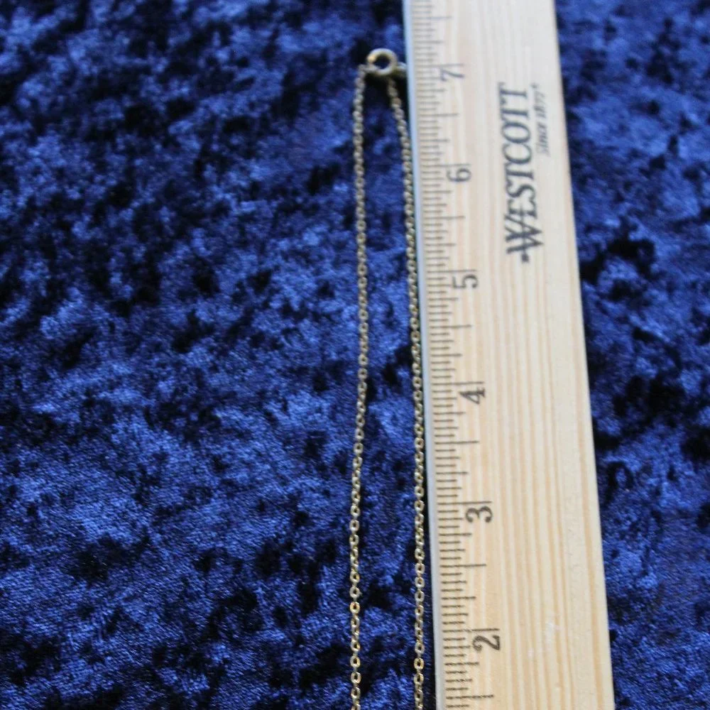 Silver toned necklace with star
